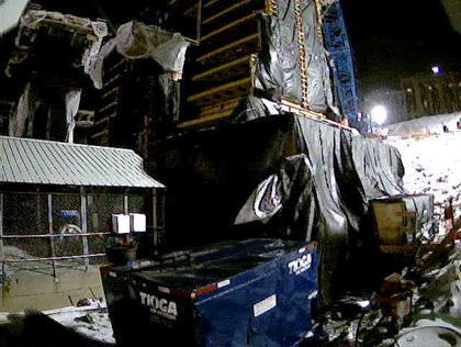 This photo shows the placement of the previously assembled and reusable column formwork (second level)  on the exterior column of pier 2 southbound. The forms were heavy enough to be seen on strain records associated with that time.