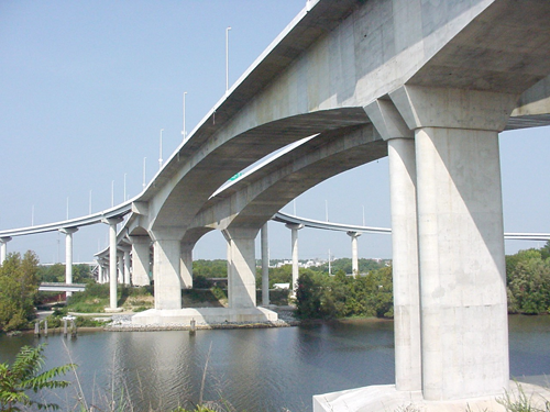 Figure 13. Photo. CIP segmental balanced cantilever bridge. This photo shows a completed cast-in-place (CIP) segmental balanced cantilever bridge over a body of water
