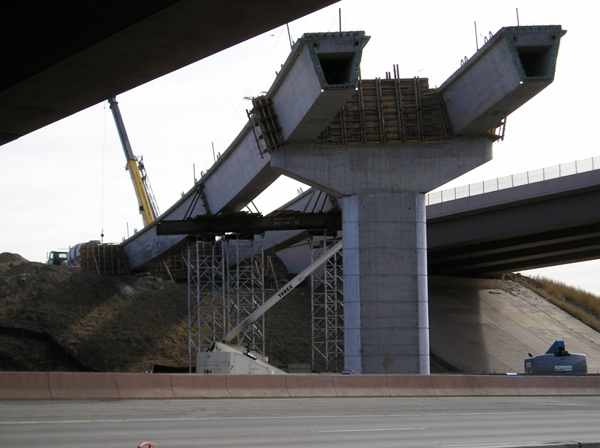 Figure 20. Photo. Precast spliced U-girder bridge during erection. This photo shows a precast spliced U-girder bridge during erection