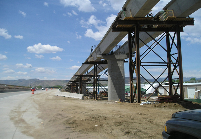 Figure 21. Photo. Precast U-girder supported on temporary false work. This photo shows a precast U-girder being supported on temporary false work during construction