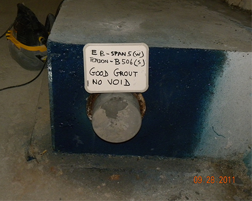 Figure 63. Photo. Exposed anchored head after grout sampling. This photo shows the end cap grout from figure 63 after cap removal. The grout appears sound with no voids.