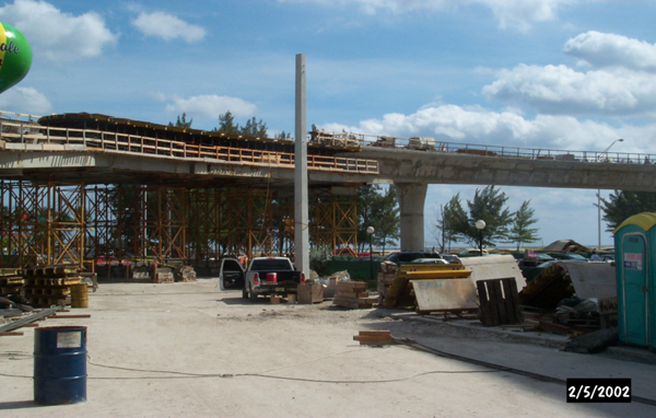 Figure 7. Photo. CIP concrete box girder bridge on false works. This photo shows a cast-in-place (CIP) concrete box girder bridge on false works that is under construction