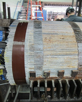 This photo shows the north side cable end following cable band removal. The top portion of the cable band has been removed. Stage 2 and stage 3 corrosion are shown on the wires from the surface of the cable. The loose wires are kept in place with duct tape. 