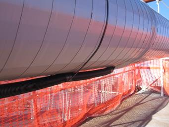 This photo shows cable temporary wrapping with neoprene and main conduit exit at the bottom of cable leading to the main DAQ (data acquisition system) at the roadway level.