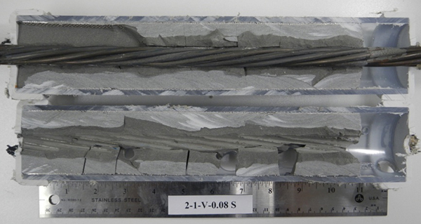 Figure 192. Photo. Stressed single-strand specimen with void and 0.08 percent chloride. This photo shows the as-extracted condition of a 0.08 percent chloride stressed single-strand specimen with void. No corrosion is visible.