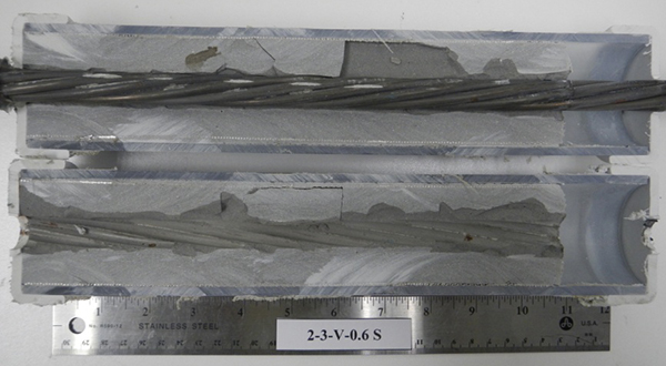 Figure 195. Photo. Stressed single-strand specimen with void and 0.6 percent chloride. This photo shows the as-extracted condition of a 0.6 percent chloride stressed single-strand specimen with void. One corrosion spot is visible.