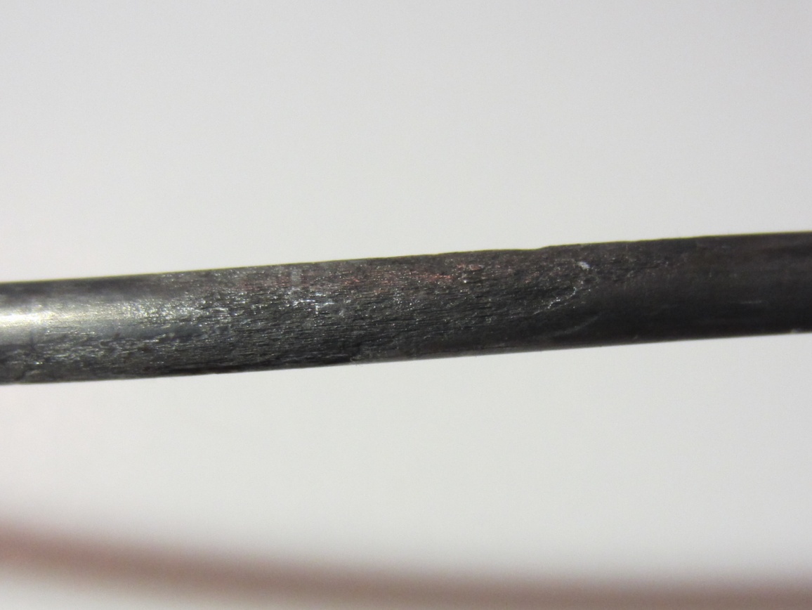 Figure 241. Photo. 0.08 percent chloride multi-strand specimen near the interface (pit depth = 2–10 mil). This photo shows moderate pitting corrosion (pit depth ranged between 
2 and 10 mil) observed on an interface strand of 0.08 percent chloride multi-strand specimen. 