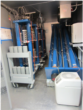 Figure 4. Photo. Inside the small environmental chamber. This photo shows the interior view of the small environmental chamber used for accelerated laboratory testing.