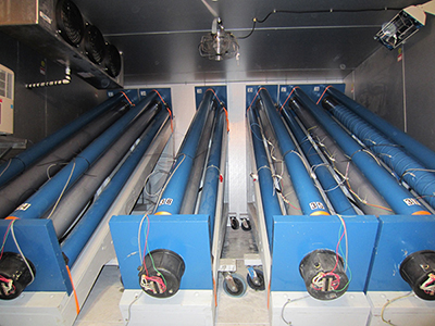 Figure 5. Photo. Inside the large environmental chamber. This photo shows the interior view the large environmental chamber used for accelerated laboratory testing.