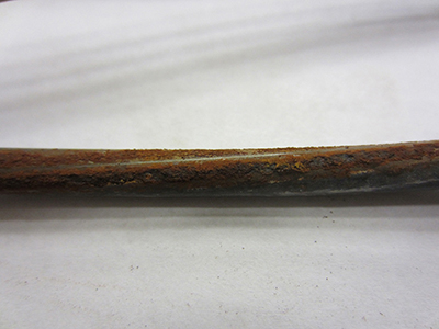 Figure 63. Photo. Example of heavy rust on the extracted wires. This photo shows an example of heavy rust observed on the extracted wires. Most areas of a wire are covered with thick corrosion products.