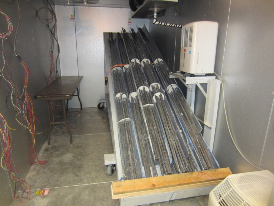 Figure 73. Photo. Storing the retrieved multi-strand samples in a chamber. This photo shows the interior of the smaller environmental chamber where the removed strands were stored at lower than 50 percent relative humidity.