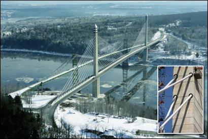 This photo, taken from an elevated angle, shows the entire span of the Penobscot Narrows Bridge, including the two pylons supporting four fans of cable-stays. The bridge is pictured next to the suspension bridge it replaced. The inset in the picture is a close-up of cable-stays threaded through the pylon.