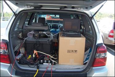 This photo shows the back of the SUV where the data acquisition system is plugged into a laptop computer. There are additional wires running out of the vehicle to attach to the accelerometers. This photo shows the back of the SUV where the data acquisition system is plugged into a laptop computer. There are additional wires running out of the vehicle to attach to the accelerometers.