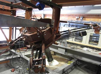 This photo shows the top rig above the roof of the wind tunnel with a spring rotation of 45 degrees. It is an X-shaped configuration pointed in the downwind direction.