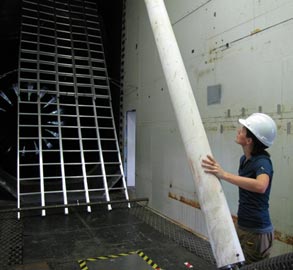 This photo shows the grid of ladders used to generate the turbulent flow field for position 2, which is 5.1 m upstream of the model. The grid consists of five ladders, each 6.4 m long, fixed side-by-side with an inclination the same as the cable model.