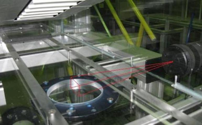 This photo superimposes a field of view sketch of where the PIV camera takes measurements above the soil sample mount.