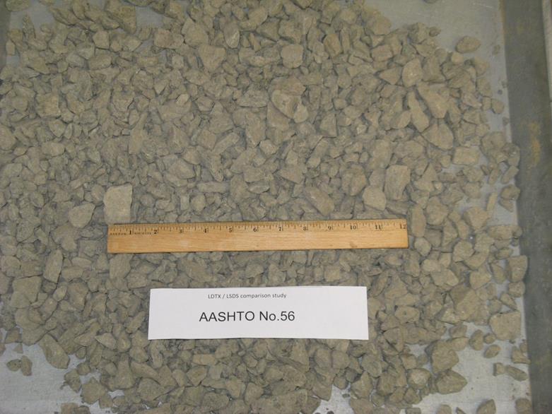 This photo shows the American Association of State and Highway Transportation Officials M43 gradation-based designated No. 56 aggregates with a diabase rock source supplied from a quarry in Ashburn, VA. The maximum values of dmax and d50, in inches, are 1.5 and 0.555, respectively. They are classified as a poorly graded gravel based on the Unified Soil Classification System. The minimum and maximum unit weights, in pounds per cubic ft, are 100.6 and 103.8, respectively.