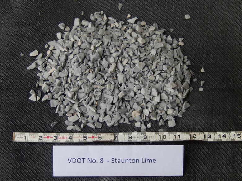This photo shows the American Association of State and Highway Transportation Officials M43 gradation-based designated No. 8 aggregates with a limestone rock source from the Triassic period, supplied from a quarry in Staunton, VA. The maximum values of dmax and d50, in inches, are 0.50 and 0.283, respectively. They are classified as poorly graded gravel based on the Unified Soil Classification System.