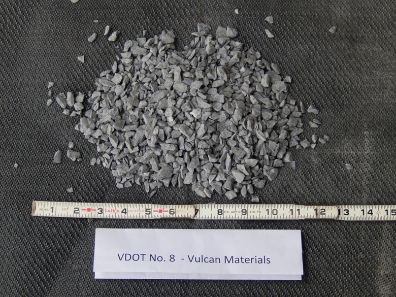This photo shows the American Association of State and Highway Transportation Officials M43 gradation-based designated No. 8D aggregates with a limestone rock source from the Triassic period, supplied from a quarry in Stafford, VA. The maximum values of dmax and d50, in inches, are 0.50 and 0.268, respectively. They are classified as a poorly graded gravel based on the Unified Soil Classification System.