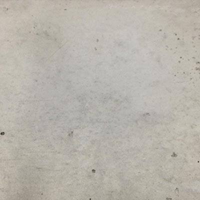 The photo shows the type of concrete surface obtained with pressure wash surface preparation methods, characterized by having a low degree of roughness.