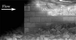 Figure 10-D. Photo. Time equals 8 seconds. The rock position at time equals 8 seconds where continued movement is indicated.