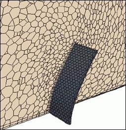 Figure 63. Schematics. Morphed mesh at maximum plate deflection. Figure shows mesh morphing using two computational schemes. Both approaches show more detailed meshes in the vicinity of the plate. Figure 63-A. Schematic. Abaqus coupling. This schematic shows the plate bending with the resulting morphing of the polyhedral mesh with the Abaqus coupling.