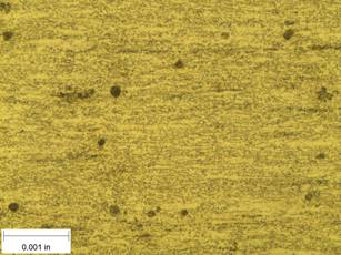 A scale bar is provided in the picture showing a dimension of 0.001 inch, and therefore the field of view is approximately 0.005 inch wide and 0.0038 inch tall. The image comprises two types of microstructures: light and dark. The microstructures appear to be evenly distributed, and there are no signs of directionality.