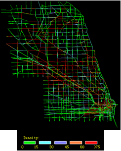 This map uses an underlying mesoscopic map of the Chicago, IL, system present density for a median snow day. The map indicates network density level using color coding (e.g., red = congested and green = uncongested) for each scenario. The network under clear weather is less congested than under median snow weather.