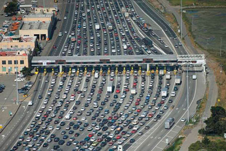 Aerial photo of a very congested multi-lane toll plaza.