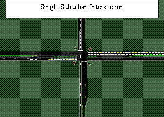 This illustration shows an illustration of a traffic intersection, the background of the illustration in green and the lanes of traffic in black, crossing in the center of the illustration. The illustration shows two lanes coming from the left-hand side which extend to three lanes before the intersection, allowing for traffic to turn left, go straight, or turn right, and extends through the intersection, returning back to two lanes. Working clockwise around the illustration, it also shows two lanes from the top allowing for traffic to turn right, left or continue straight through the intersection where the lanes merge into a single lane. From the right hand side, two lanes extend to three prior to the intersection, allowing for traffic to turn left, right, or continue straight through the intersection where the three lanes return to two. Finally, the illustration shows a single lane from the bottom extending into three lanes, allowing for traffic to turn left, right, or continue straight through the intersection where the three lanes reduce to two lanes.