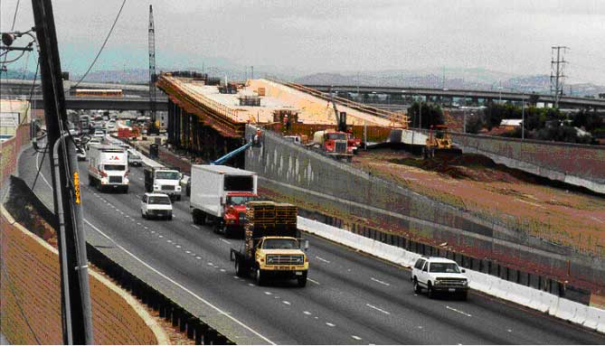 Figure 1-2. Freeway-to-freeway HOV bypass lane structure under construction at intersection of CA 57 and CA 91 freeways in Anaheim,CA. Photograph of construction of freeway-to-freeway bypass bridge structure for high-occupancy vehicle traffic.