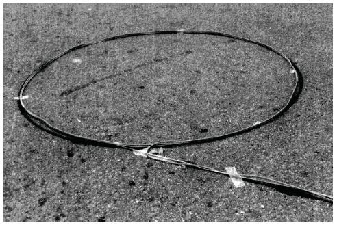 Figure 5-10. Prewound loop installation. Photograph of prewound wire loop with required number of turns and lead-in wire.