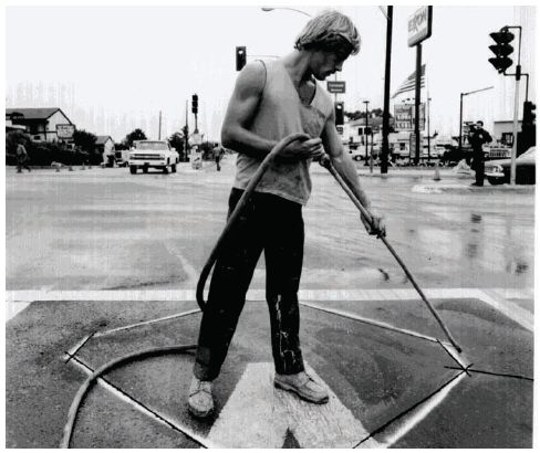 Figure 5-4. Pavement blow drying. Photograph of pavement being blow dried.