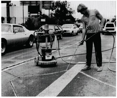 Figure 5-6. Inserting loop sealant. Photograph of sealant pouring operation.