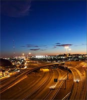 Image of cars driving on a freeway at dusk