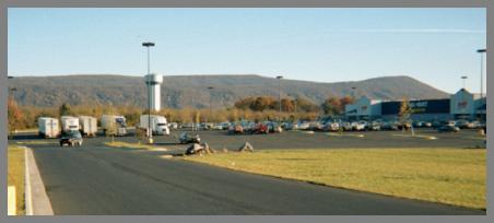 Figure 4. Example of truck parking available at a large retail store. Photo illustrating a parking lot of a large retail store with spaces available for truck parking.