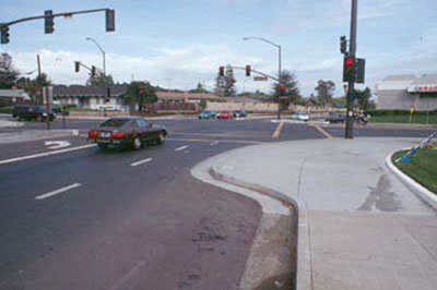 Figure 68. Intersection with curb extension. Photo. The picture shows a curb extension that narrows the street width.