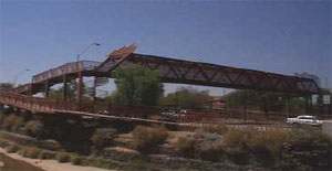 Figure 38. Photo. Grade-separated crossings are sometimes used when other measures are not feasible to provide safe pedestrian crossings. This photo shows a pedestrian bridge that crosses over a busy roadway.