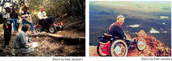 Figure 14: Photo. Off-road racing wheelchair. A man is in an off-road racing wheelchair. He is on a trail in the woods. Figure 15: Photo. Another off-road racing wheelchair. A man is in an off-road racing wheelchair. He is on a cliff overlooking a valley.