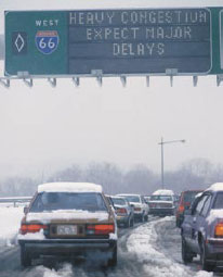 Cars driving through snow and ice.