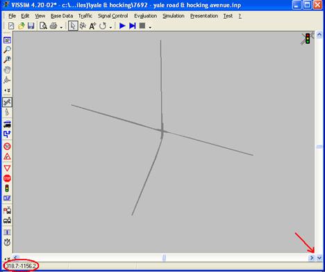 Figure 76. Screen Capture. VISSIM Screen--Record Lower-Right Corner Coordinates. This screen displays how to get the lower-right corner coordinates within the VISSIM network. A red arrow points to the lower-right corner of the network and the corresponding (x, y) coordinates are shown at the bottom of the screen.