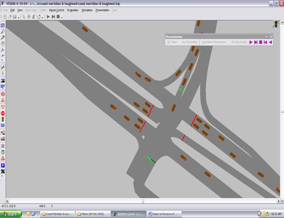 Figure 244. Screen Capture. First Vehicle Stops and Second Vehicle Decides to Change Lane. This is a screen capture from a running VISSIM simulation. Two vehicles stop at the red light on the eastbound approach, with two more vehicles (referred to as the first vehicle and the second vehicle) arriving after each other. The first vehicle has come to a complete stop, while the second vehicle has decided to change lanes and queue up on the outer left lane of the eastbound approach.