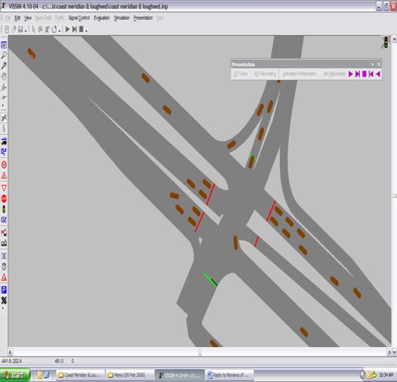 Figure 245. Screen Capture. Second Vehicle Changes Lanes and Stops. This is a screen capture from a running VISSIM simulation. Two vehicles stop at the red light on the eastbound approach, with two more vehicles (referred to as the first vehicle and the second vehicle) stop behind. The first vehicle has come to a complete stop, while the second vehicle changes lanes and stops diagonally.