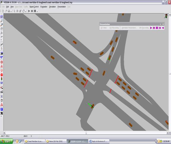 Figure 246. Screen Capture. Third Vehicle Arriving. This is a screen capture from a running VISSIM simulation. Two vehicles stop at the red light on the eastbound approach, with two more vehicles (referred to as the first vehicle, the second vehicle, and the third vehicle) stop behind. The first vehicle has come to a complete stop, while the second vehicle has changed lanes and stopped diagonally. A third vehicle is arriving at the eastbound intersection.