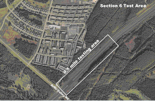 Figure 24.  Photograph.  Test section 6.  An aerial photograph illustrates the location of test section 6 on the Glenn Highway State Route 1 outside Anchorage, AK.  The testing area is located on a straight section of the highway.  There is an interchange with Arctic Valley Road immediately before the beginning of the test section at the bottom of the photograph.  The test section is approximately 0.5 mi long.