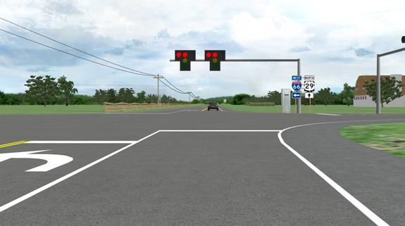 Figure 1. Screenshot. Simulated signalized intersection with activated infrastructure-based red light violator warning. This screenshot from the driving simulation shows the signalized intersection from the driver's perspective. There are two signal heads above the travel lane of the road that are mounted on a mast arm. The signal heads have glare shields that form a T. At the top of each T, two lights are illuminated. One of these lights is in the normal position of the red traffic signal in the middle of the T directly above the yellow and green lenses that are not illuminated. The other illuminated light is on the left side of the T. In the driving simulation, the lens to the left and right of the top center lens alternate at 2 Hz.