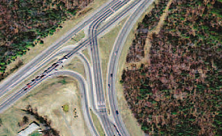 Figure 3. Photo. A 3-legged partial DLT intersection in Accokeek, MD. The photograph represents a 3-legged partial displaced left-turn (DLT) intersection in Accokeek, MD. In the photo, only one crossover area is present.