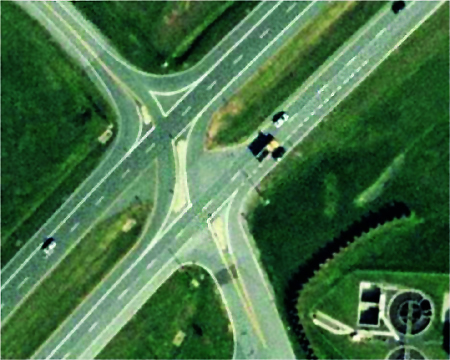 The photograph shows an aerial view of a restricted crossing U-turn (RCUT) intersection at U.S. Route 15 in Emmitsburg, MD. Only the central part of the intersection is shown in the figure, and the median U-turns are not shown.