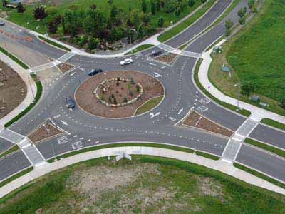 The photo provides an example of a typical roundabout.