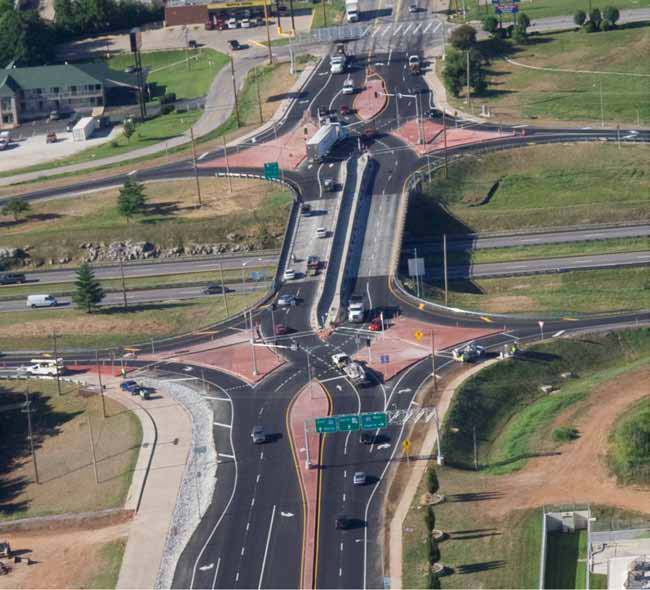 The photo shows the first double cross diamond (DCD) interchange in the United States at the crossing of I-44 and Route 13 in Springfield, MO.